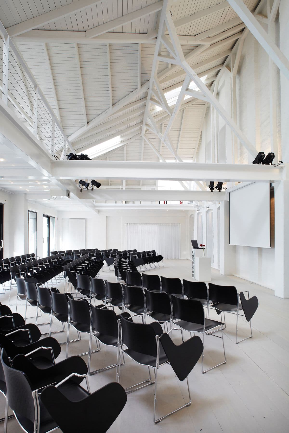 Image of chairs set up and ready for an event in the Concert Hall at Mogens Dahl Concert Hall. The picture shows an organized arrangement of chairs prepared for the upcoming event.